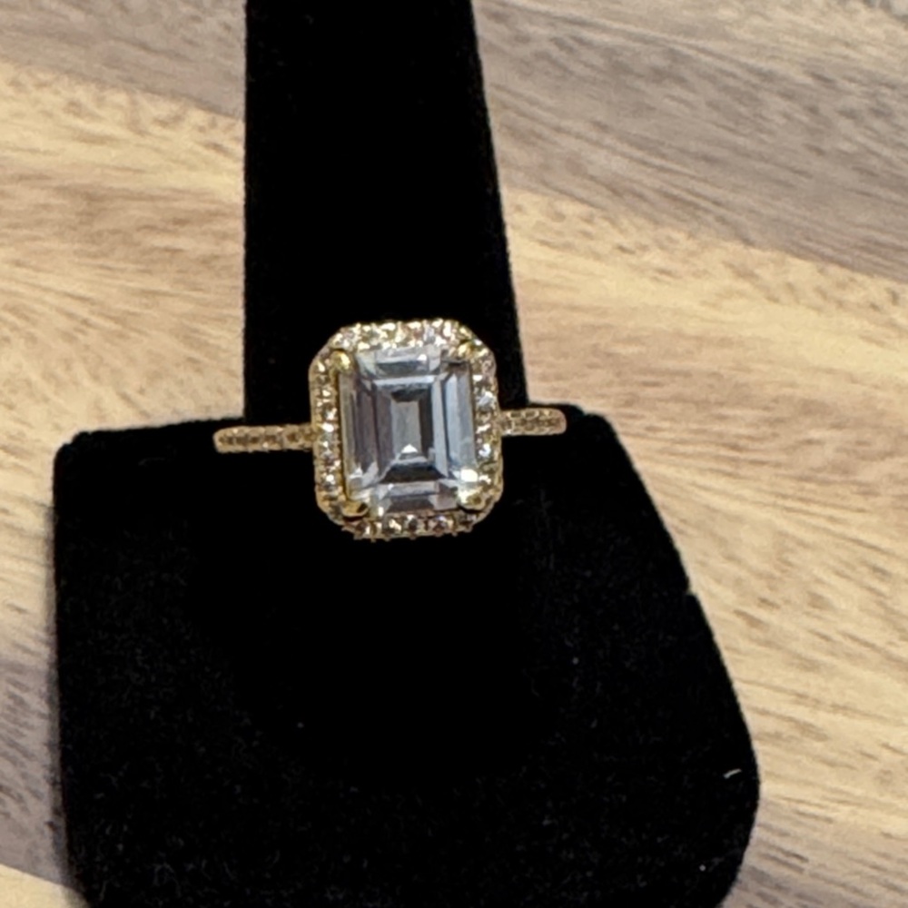 Elegant Gold filled and with emerald cut center stone women's Ring size 7.